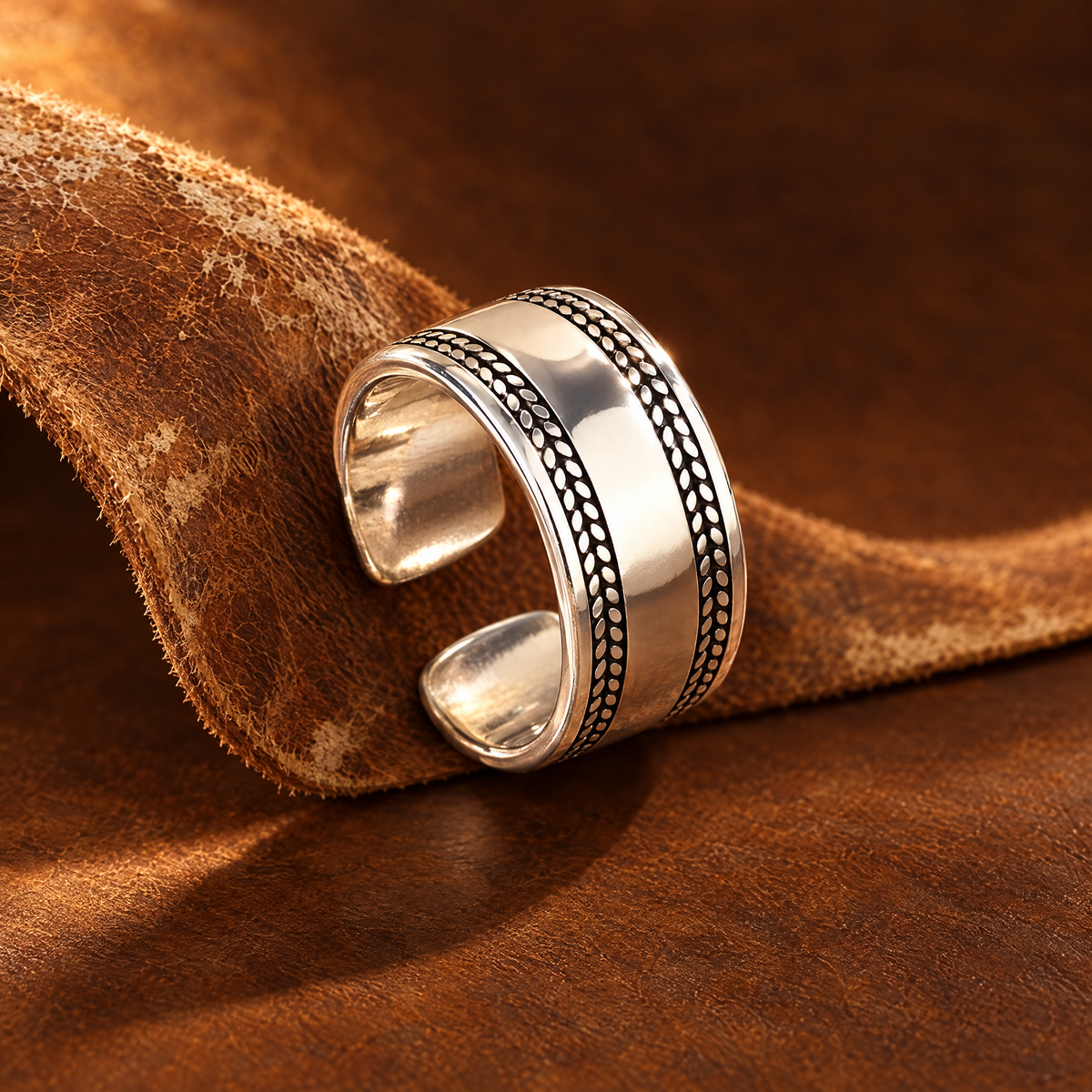 Open Range Ring threaded on a strip of tan cowhide leather