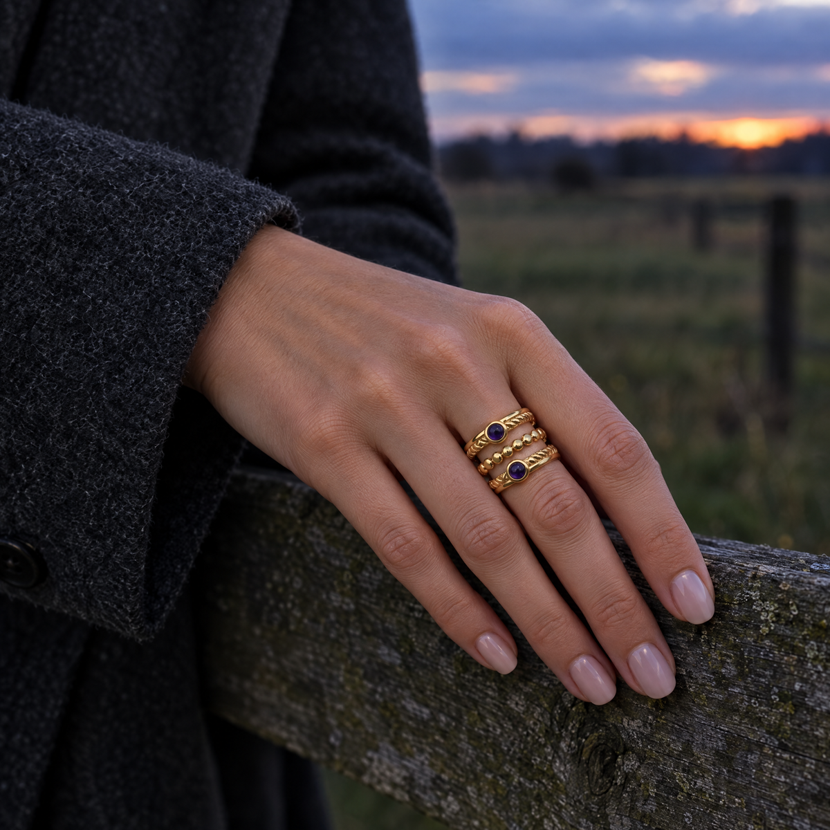 Twilight Lasso Ring worn on hand at twilight pasture fence